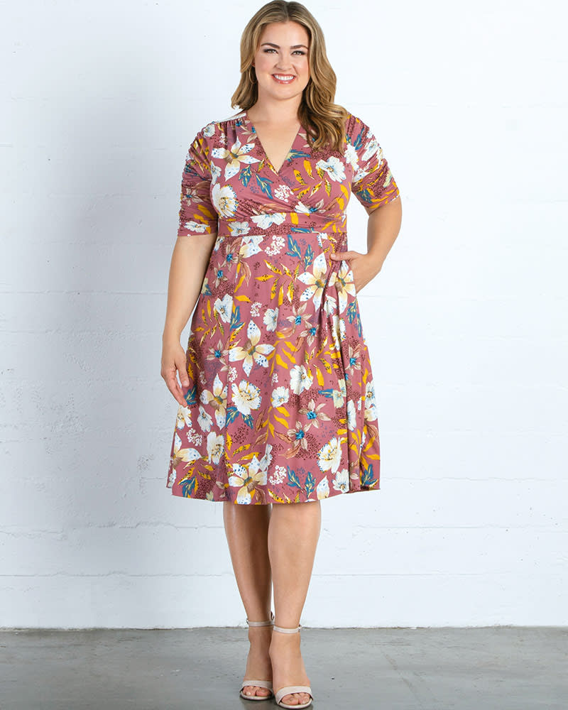 Front of a model wearing a size 0X Gabriella Dress in MAUVE FLORAL PRINT by Kiyonna. | dia_product_style_image_id:227363